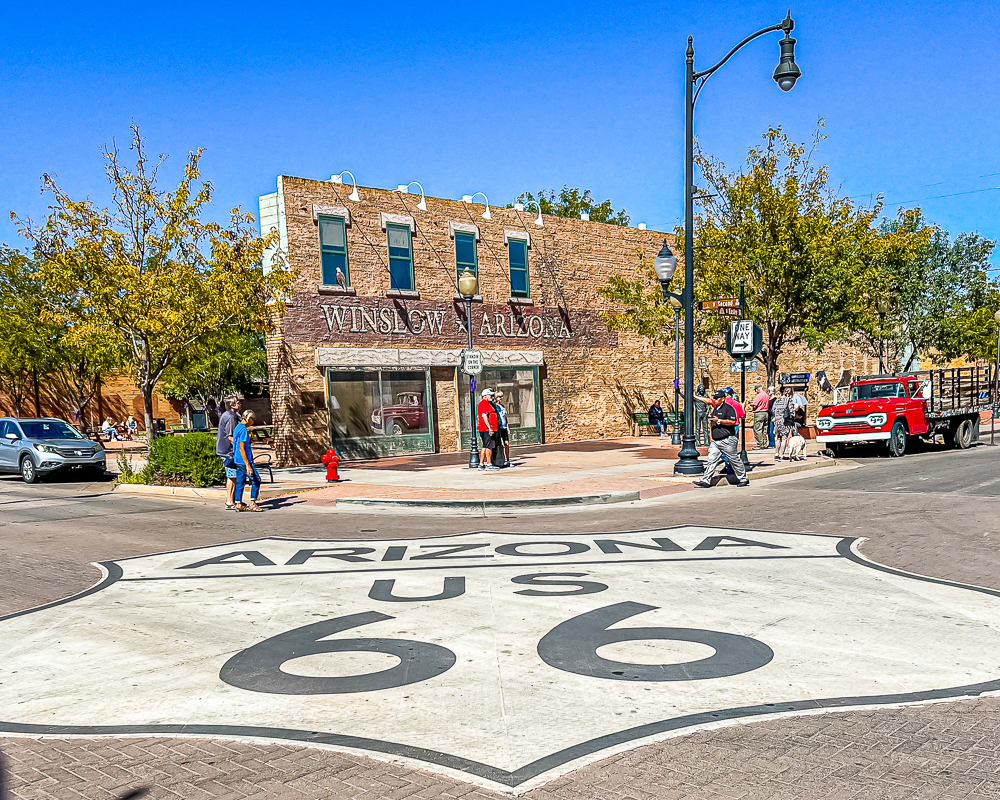 Route 66 Sign in the middle of the intersection in Winslow, Arizona.